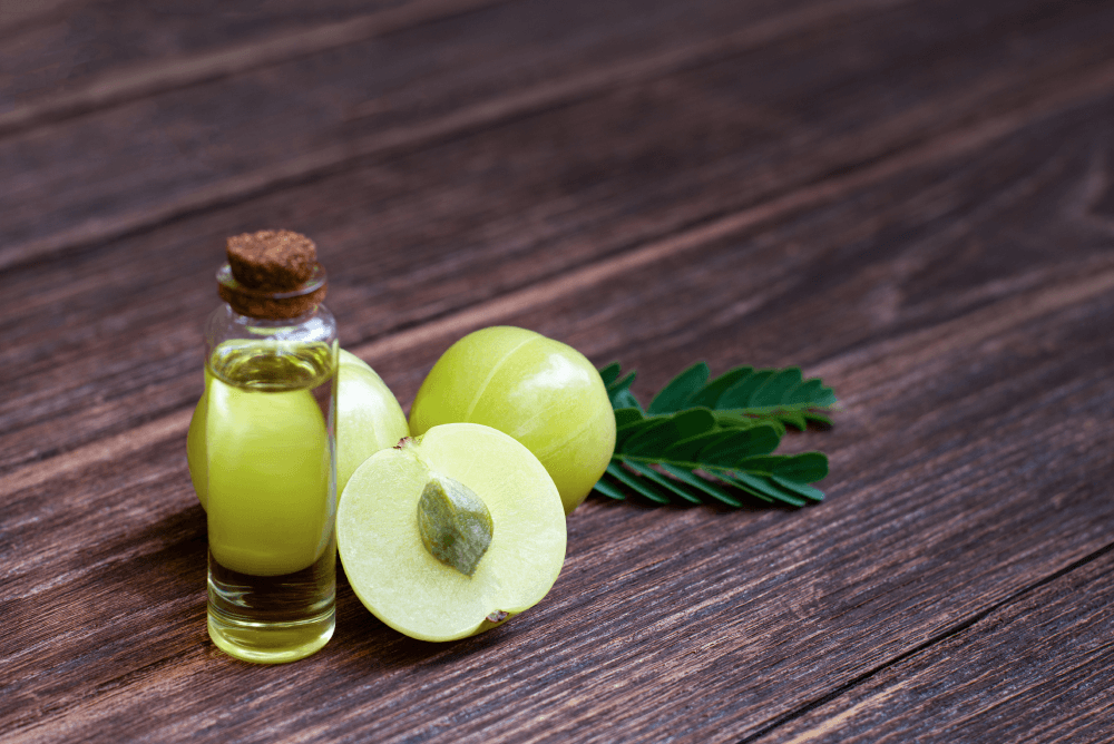 How does Amla oil benefit hair growth and thickness?