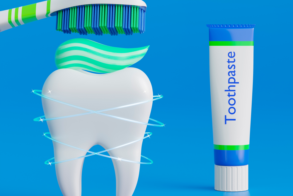 Gel toothpaste on a toothbrush with mint leaves for freshness